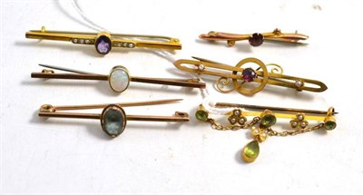 Lot 584 - Six gem set bar brooches, including a seed pearl and peridot brooch, an opal brooch, an...