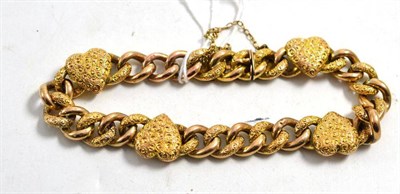 Lot 597 - A heart and curb textured bracelet, length 20.5cm