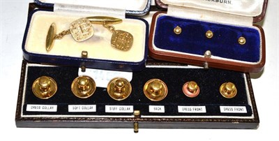 Lot 604 - A cased set of shirt studs stamped '18ct', another set of shirt studs and a pair of cufflinks...