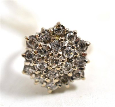 Lot 635 - An 18ct white gold diamond cluster ring, three rows of round brilliant cut diamonds in white...