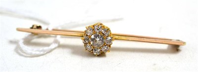 Lot 643 - A diamond cluster bar brooch, total estimated diamond weight 0.60 carat approximately, length 5.3cm