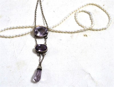 Lot 644 - A freshwater cultured pearl necklace, length 41cm and an early 20th century amethyst drop necklace