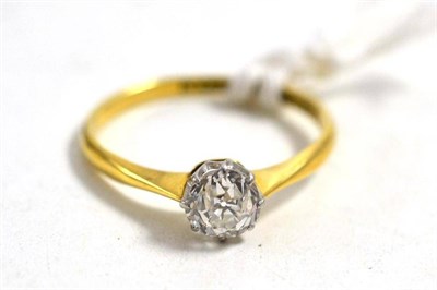 Lot 658 - A diamond solitaire ring, the old brilliant cut diamond in a white claw setting, to a yellow...