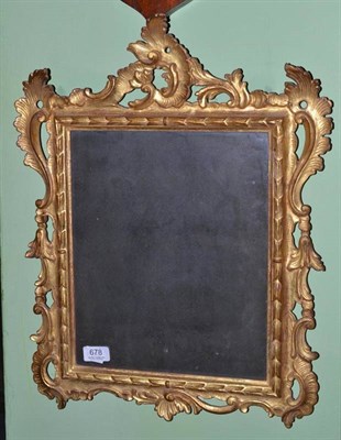 Lot 678 - An Italian carved gilt mirror, height 56cm