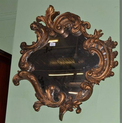 Lot 681 - A early 19th century gilt Rococo style mirror