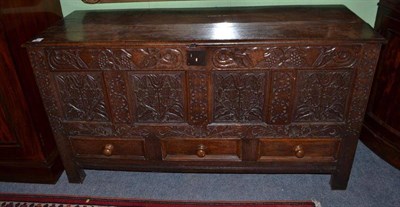 Lot 695 - Carved oak coffer with three drawers