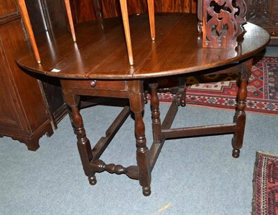 Lot 707 - An early 18th century oak gateleg table