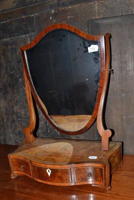 Lot 713 - A George III satin mahogany rosewood banded toilet mirror, of serpentine outline with shield shaped