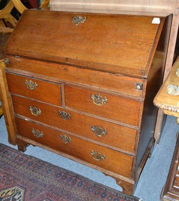 Lot 724 - George III oak bureau