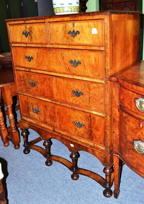 Lot 746 - George I style walnut and feather banded five drawer chest on stand