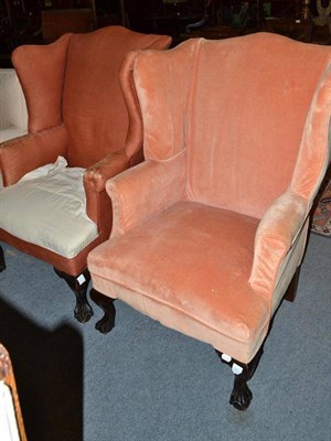 Lot 748 - Two wing back chairs on claw and ball feet