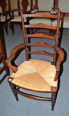 Lot 756 - A ladder back chair with rush seat