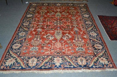 Lot 764 - Modern Ziegler design carpet, the abrashed rust field with palmettes and angular vines enclosed...