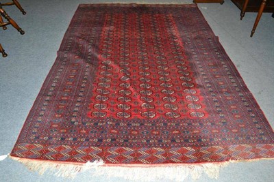 Lot 765 - Bukhara carpet, probably Lahore, the strawberry field with five rows of quartered guls enclosed...