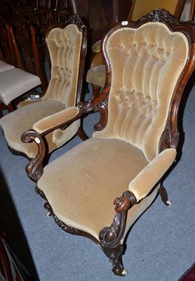 Lot 773 - A pair of Victorian walnut framed open armchairs, upholstered in beige velvet