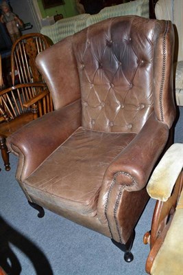 Lot 776 - Leather wing easy chair