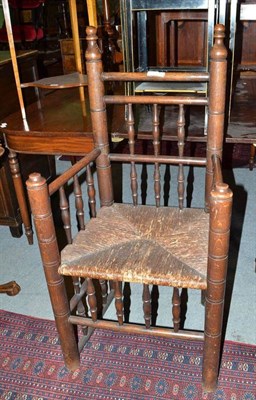 Lot 786 - 17th century style oak spindle armchair with rush seat