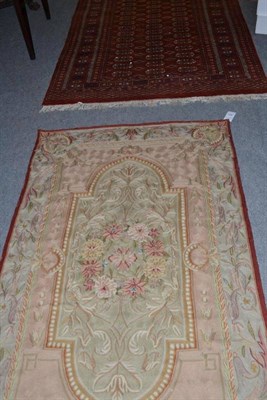 Lot 788 - Kashmir chain stitch rug , the ivory field with floral sprays framed by spandrels and floral...