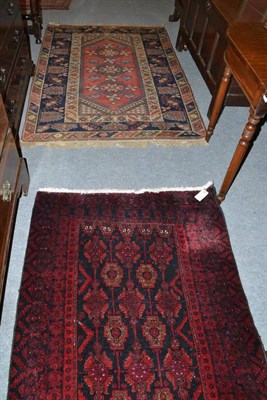 Lot 800 - Dosemialti rug, West Anatolia, the raspberry lozenge field with three hooked medallions framed...