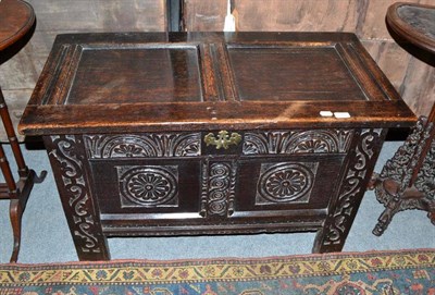 Lot 814 - An oak two panel coffer