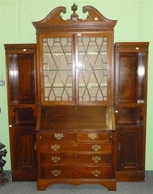 Lot 835 - A late 19th century/early 20th century mahogany bureau bookcase with swan neck pediment and...