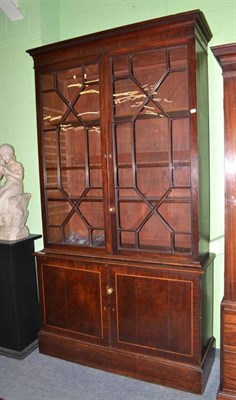 Lot 845 - Mahogany glazed door bookcase, a marriage (a.f.)