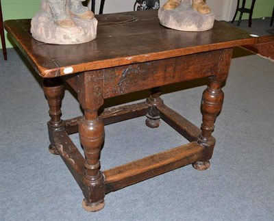 Lot 851 - A 16th/17th century plank top oak table