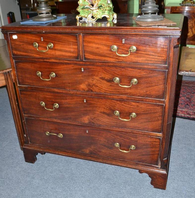 Lot 856 - George III mahogany five drawer straight fronted chest with canted stiles