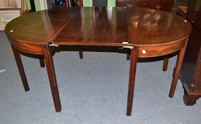 Lot 857 - George III mahogany D-end dining table fitted with one leaf