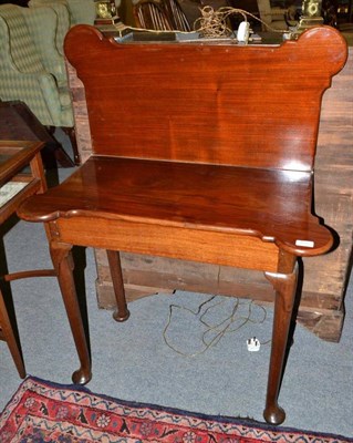 Lot 859 - 18th century mahogany fold-over tea table on pad feet