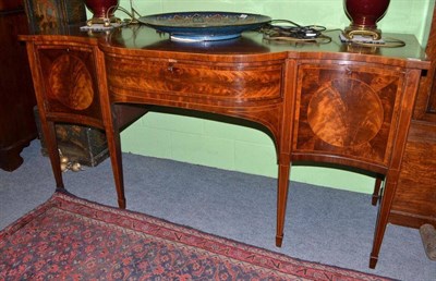 Lot 866 - Late George III mahogany serpentine shaped sideboard on square tapering legs