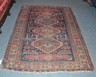 Lot 873 - An Antique Karashli Shirvan rug, East Caucasus, the indigo field of stepped hexagons surrounded...