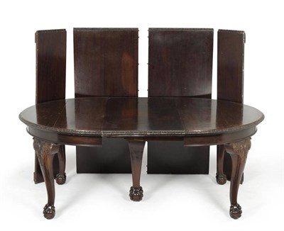 Lot 880 - A mahogany extending dining table, late 19th century, of rounded rectangular form with foliate...