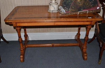 Lot 886 - Victorian satinwood centre table