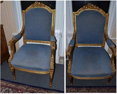 Lot 900 - A pair of Louis XV style gilt armchairs