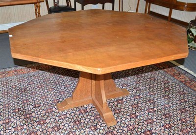 Lot 907 - A Yorkshire School oak 5'5"; octagonal dining table, on a cruciform base, unmarked, 135cm,...