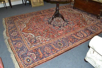 Lot 917 - Avar Heriz carpet, Persian Azerbaijan, the field of floral vines around an indigo flowerhead...