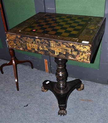 Lot 919 - A Chinese export gilt and black pedestal games table, early 19th century, richly painted with...