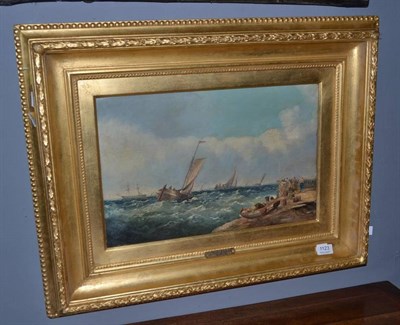 Lot 1123 - Follower of Alfred Montague (1832-1883) Man of War and fishing boats in a harbour, bears signature