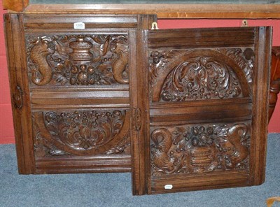 Lot 1205 - Pair of carved oak door panels