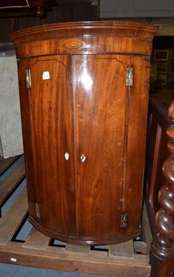 Lot 1236 - Georgian inlaid bow front corner cupboard