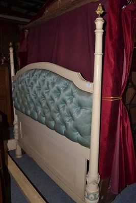 Lot 1238 - A cream painted double bed with buttoned headboard, the frame carved with swags of drapes and...