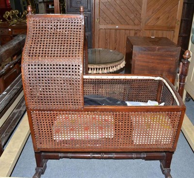 Lot 1239 - George IV caned mahogany cradle in swing frame with hangings etc