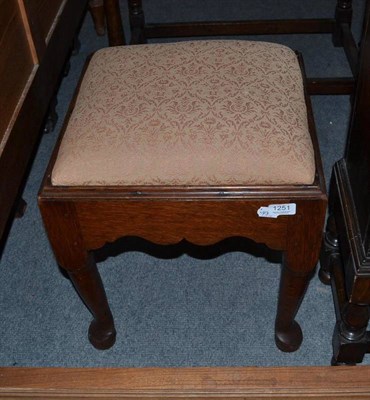 Lot 1251 - A Georgian oak stool