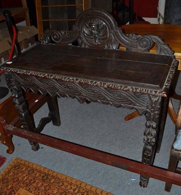 Lot 1254 - Carved oak side table