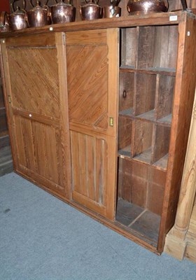 Lot 1263 - Pitch pine storage unit with sliding doors