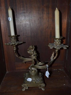 Lot 1272 - A bronze twin branch candelabrum in Regency style