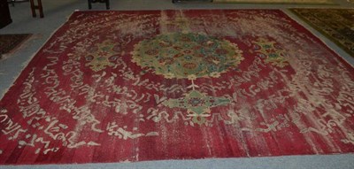 Lot 1297 - An unusual Amritsar carpet, Punjab, the raspberry field centred by an apple green pole...