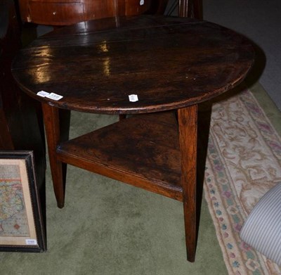 Lot 1308 - An 18th century oak cricket table, with triangular lower tier and plank constructed top, 68cm...