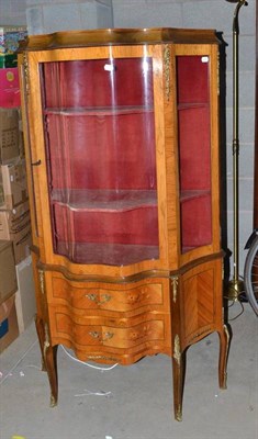 Lot 1338 - A Louis XV style rosewood serpentine fronted display cabinet